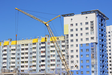 Image showing yellow crane and blue sky on building site