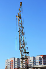 Image showing yellow crane and blue sky on building site