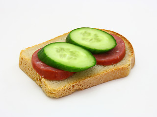 Image showing sandwich with sausage and a cucumber 