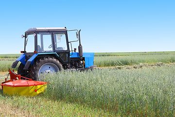 Image showing Tractor in a field, agricultural scene in summer