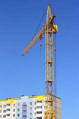 Image showing yellow crane and blue sky on building site