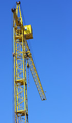 Image showing yellow crane and blue sky on building site