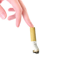 Image showing Cigarette in a hand on the white