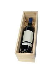 Image showing Red wine bottle in wooden box with soft shadow