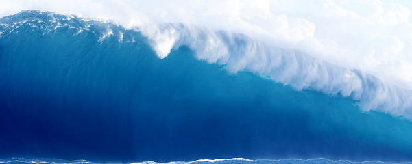 Image showing Large Blue Surfing Wave Breaks in the Ocean