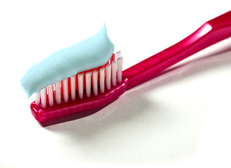 Image showing A toothbrush with toothpaste on a white