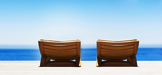 Image showing Beach chairs on perfect tropical sand beach