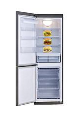 Image showing three cheeseburgers in empty refrigerator