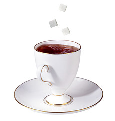 Image showing Cup of tea and falling sugar cubes