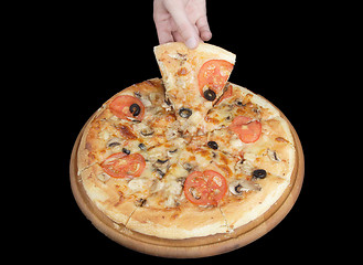 Image showing Tasty pizza and hand on black background