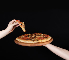 Image showing pizza plate on the human hand