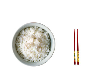 Image showing Chopsticks on a white bowl against a white tablecloth