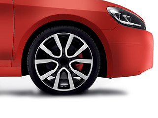 Image showing Cherry red car front detail with big light-alloy wheel