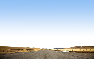 Image showing Long and winding road running through forests