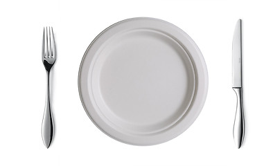 Image showing Place setting with high-gloss plate, knife & fork.