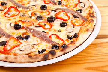Image showing Pizza with olives and fish