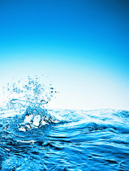 Image showing blue water splashing isolated on white background