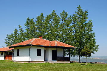 Image showing White house on green lawn