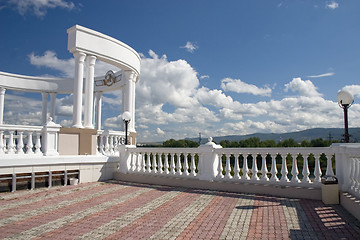 Image showing Arch with white columns and balustrade.