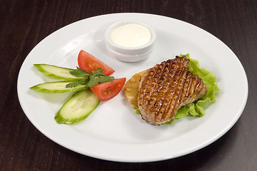 Image showing Piece of fried meat with vegetables.