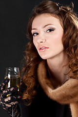 Image showing woman in an night dress with a champagne glass