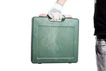 Image showing Green tool box in workers hand