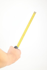 Image showing hand measuring by tape measure