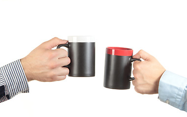 Image showing Businessman hand holding a cup of tea