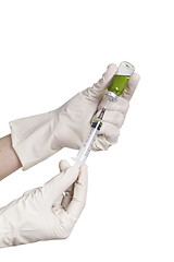 Image showing Hand holding syringe isolated on white