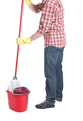 Image showing man puts the mop in a bucket