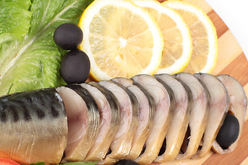 Image showing sliced herring on wooden plate