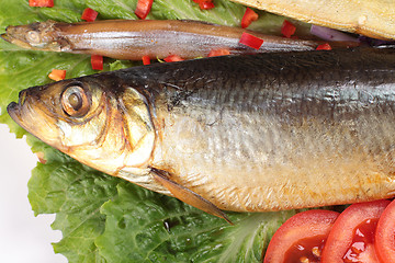 Image showing fish on plate with red pepper