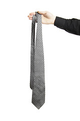 Image showing man holding gray tie isolated