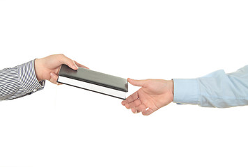 Image showing Hand holding a book