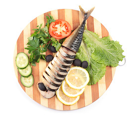 Image showing sliced herring on wooden plate