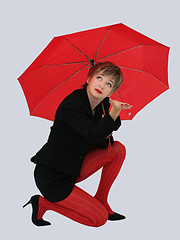 Image showing Businesswoman with a red umbrella