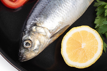 Image showing fish on pan with lemon