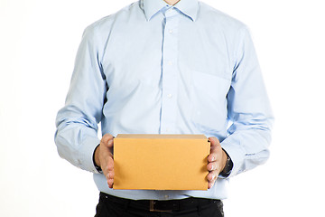 Image showing Businessman holding a paper box isolated