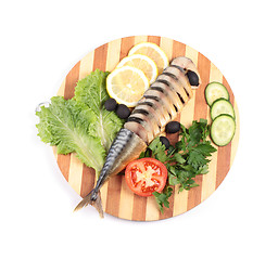 Image showing sliced herring on wooden plate