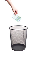 Image showing hand gold euro to trash can