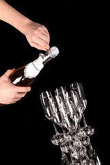 Image showing man hands opening champagne bottle