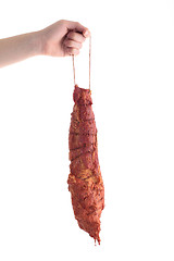 Image showing hand holding meat