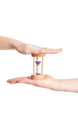 Image showing man and woman hands holding Hour Glass