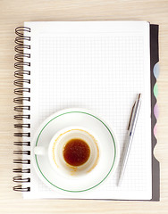 Image showing blank page, empty cup of coffe, pen