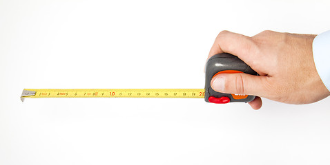 Image showing Hand holding a measuring roulette