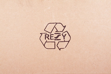 Image showing torn out piece of cardboard with recycle symbol