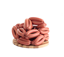 Image showing sausages on wooden plate