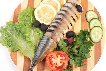 Image showing sliced herring on wooden plate