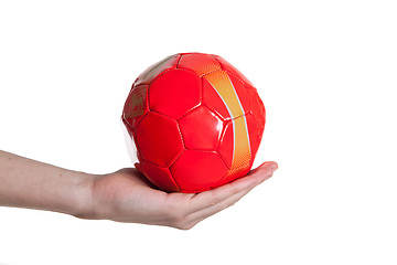 Image showing man holding red small football ball