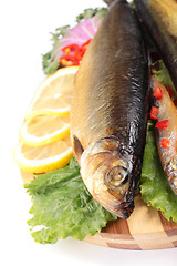 Image showing fish with lemon on plate